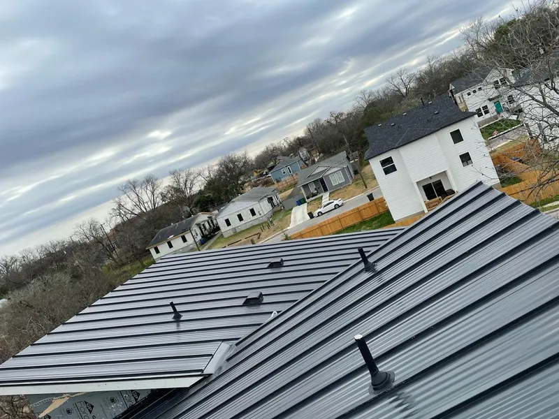 Standing seam metal roof panels with vents for Skylight Repair in Brookhaven